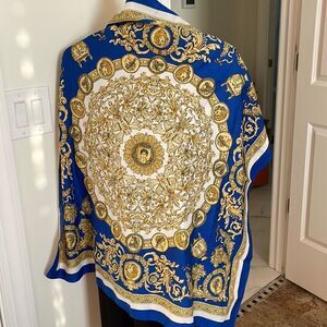 Large scarf by Accessory Station. Very pretty blue.  Polyester